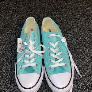 Brand new with tags blue low top converse. Men’s size 7 women’s size 9